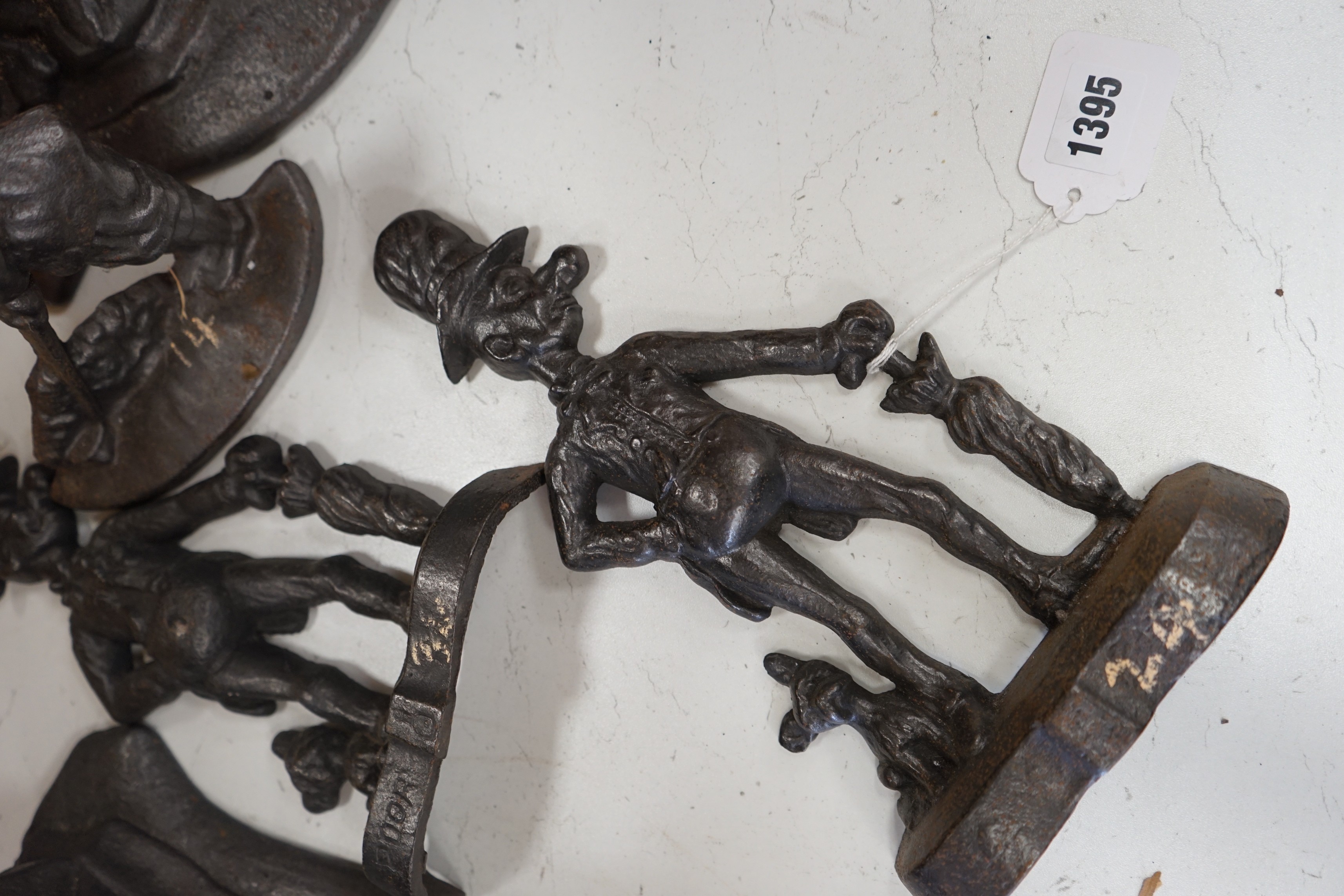 Five assorted Victorian figural cast iron doorstops